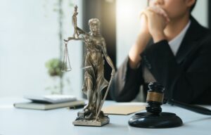 Judge gavel with Justice lawyers, Businesswoman in suit or lawyer working on a documents. Legal law, advice and justice concept.