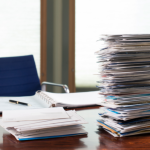 utility and medical bills piled up on desk 