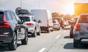Cars rush hours city street. Car on highway in traffic jam on road.